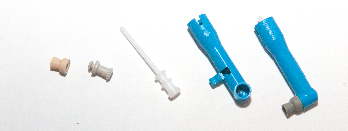 The four components of a prophy angle and the completed assembly